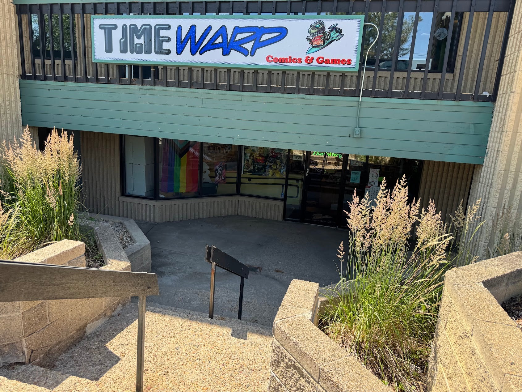 Storefront with 'Time Warp Comics & Games' sign above the entrance